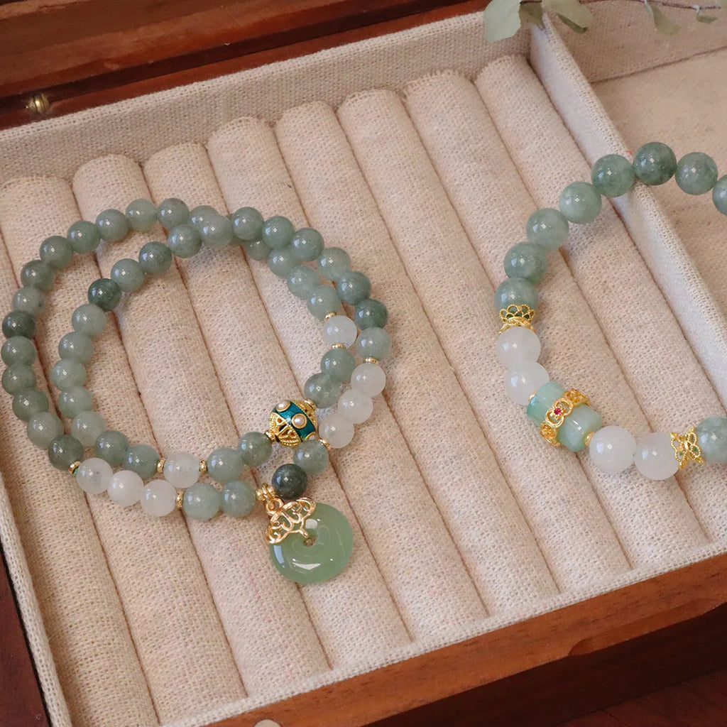 Women's jade safety buckle bracelet with geometric beads and traditional peace buckle clasp.