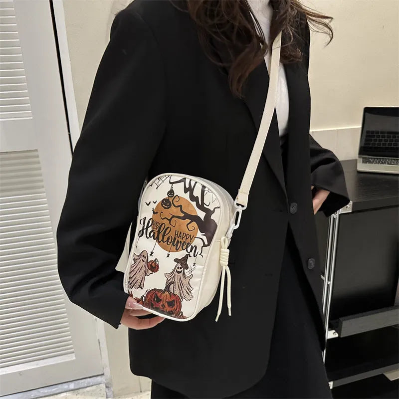 Halloween graffiti print crossbody bag with cartoon pumpkin, ghost and bat designs