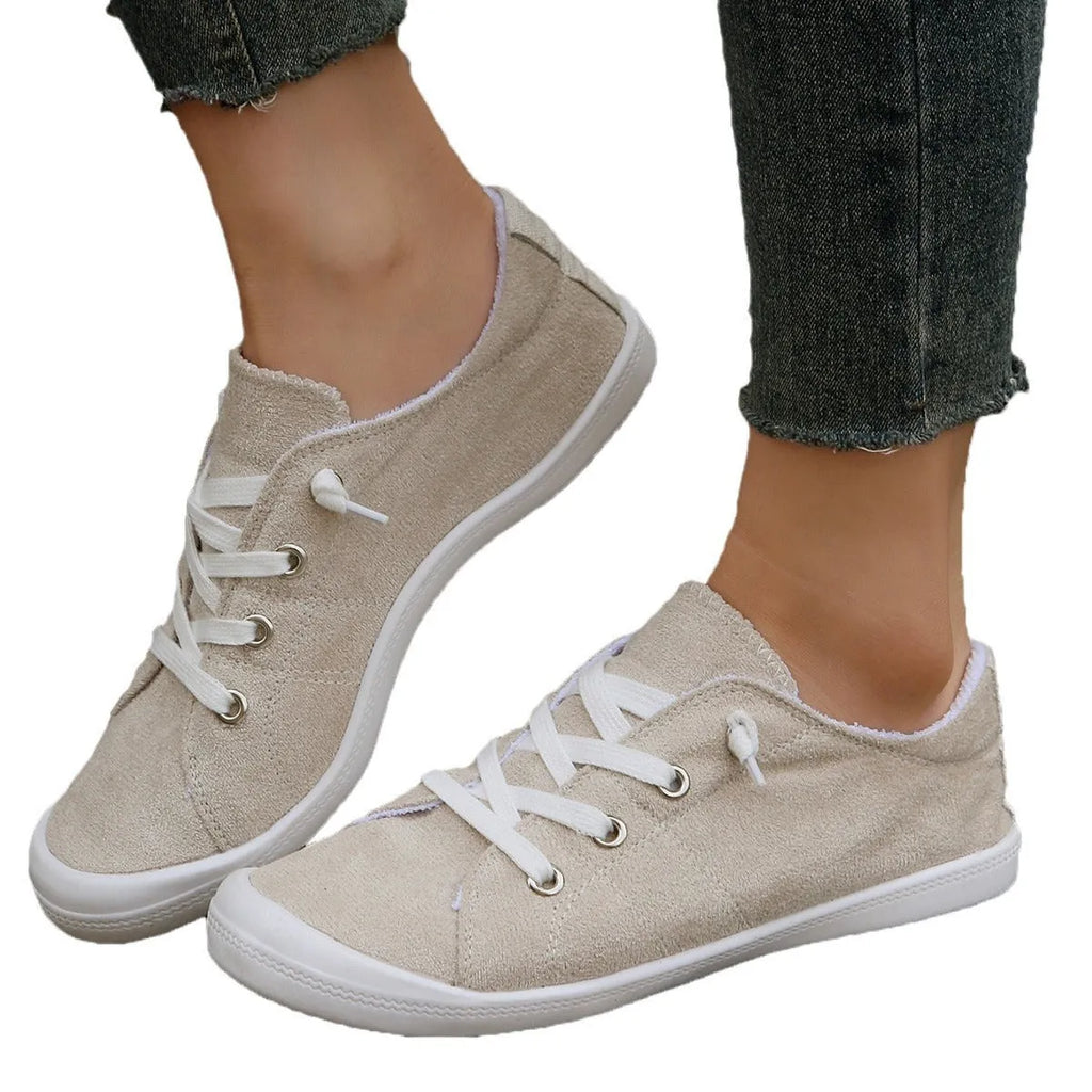 Women's creamy white casual sneakers with fabric upper and rubber sole