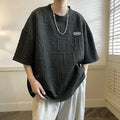 Men's grey loose fit short sleeve t-shirt with a raised white retro letter pattern on the chest.