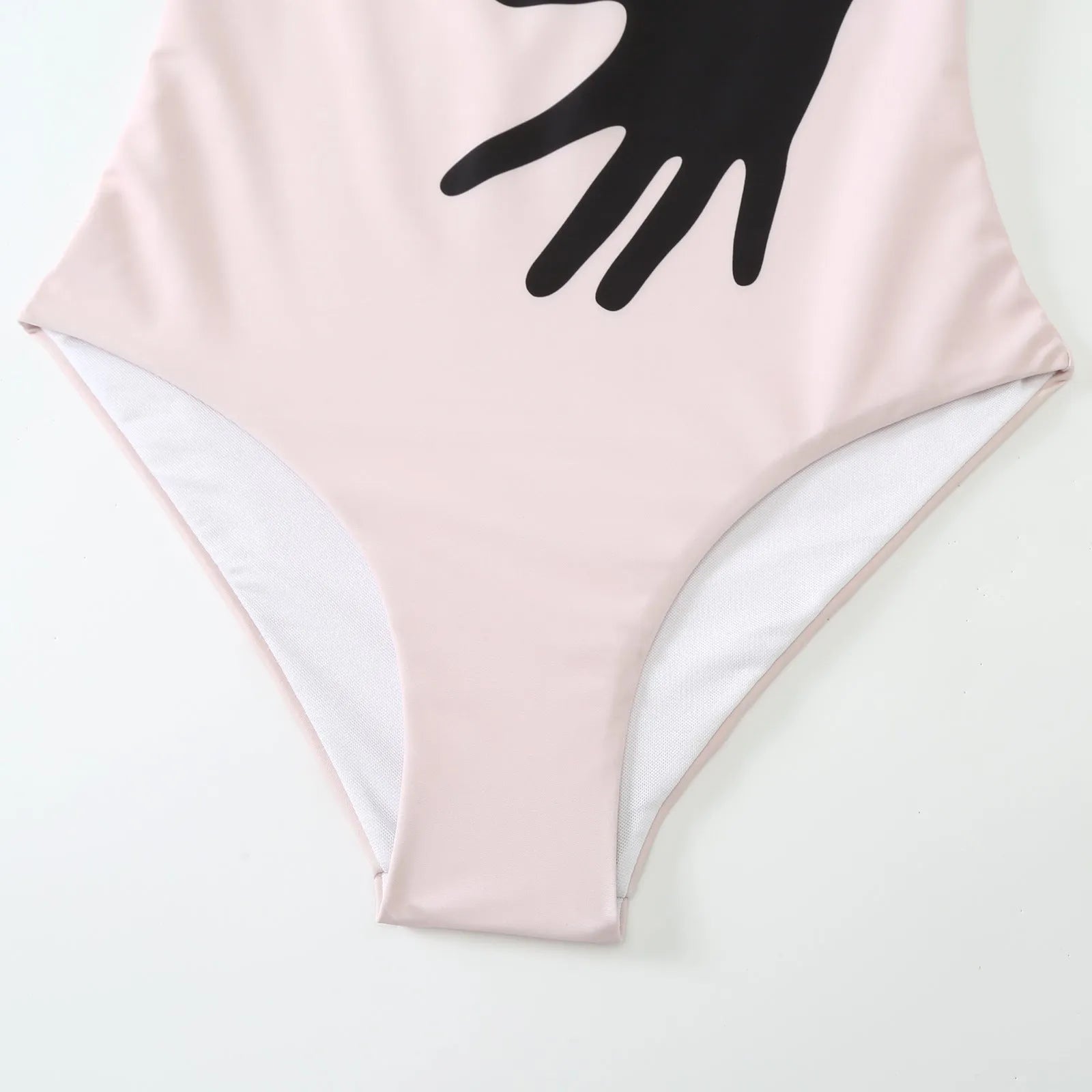 Women's one-piece bikini swimsuit with an attached white tulle skirt, shown on a mannequin.