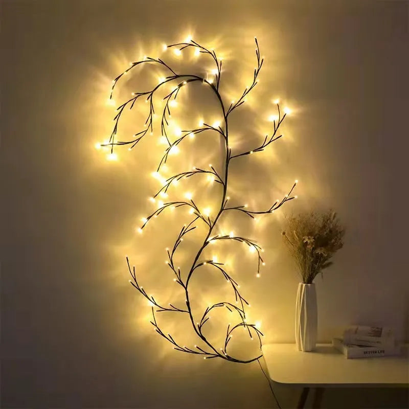 Flexible DIY LED willow vine garland light with warm white LEDs bent into a decorative shape.