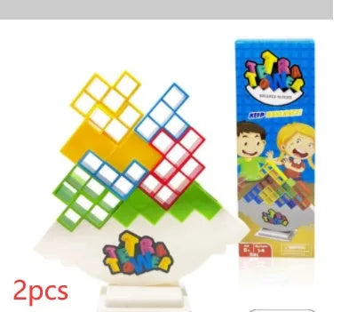 Plastic balance stacking game with 16 coloured blocks, chassis, and base on a table.
