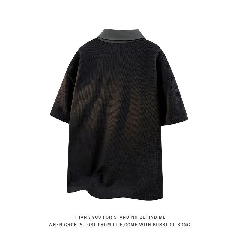 Men's black padded polo shirt sweater with a heavy Henry collar and short sleeves