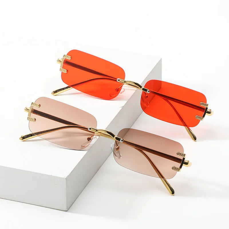 Retro square frameless sunglasses with metal frame and AC lenses, shown in gold or black frame colour options