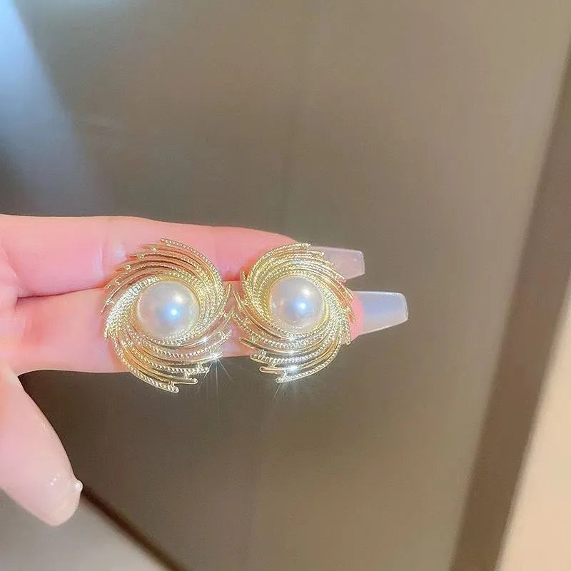 Vintage style earrings with simulated pearl drops in irregular flower shape design