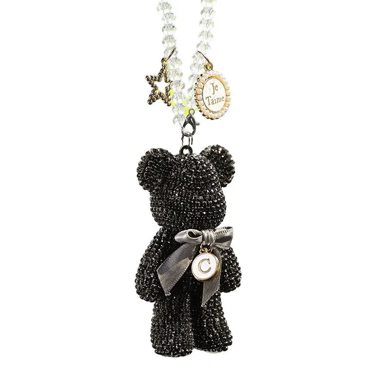White, pastel, and black Violent Bear car mirror pendant with rhinestones, 5cm by 9cm.