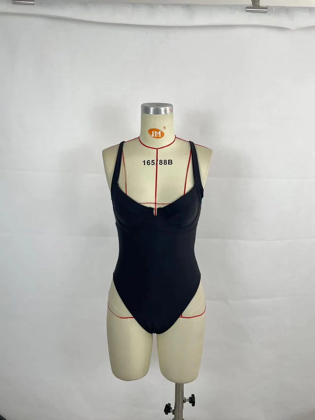 Women's contrast colour one-piece swimsuit bikini in black or red, polyester with nylon lining, briefs style, sizes S to XL.