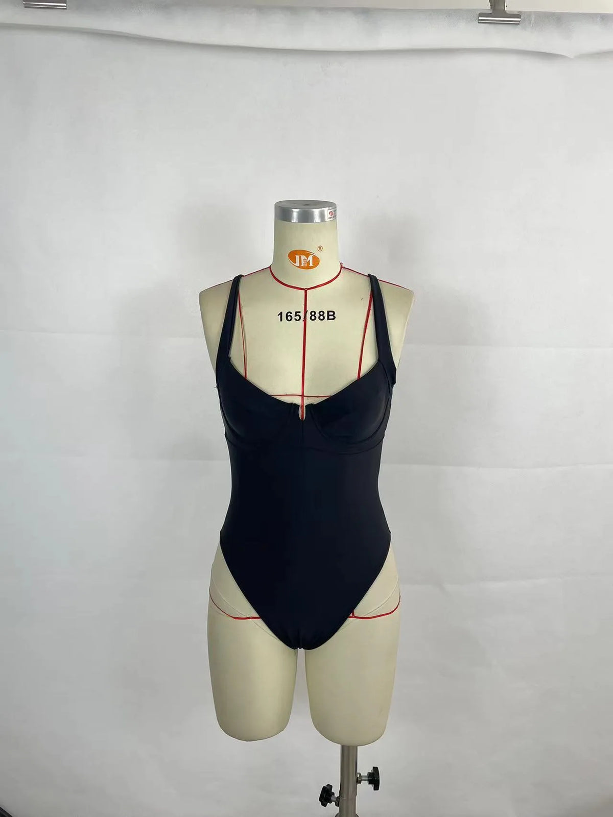 Women's contrast colour one-piece swimsuit bikini in black or red, polyester with nylon lining, briefs style, sizes S to XL.