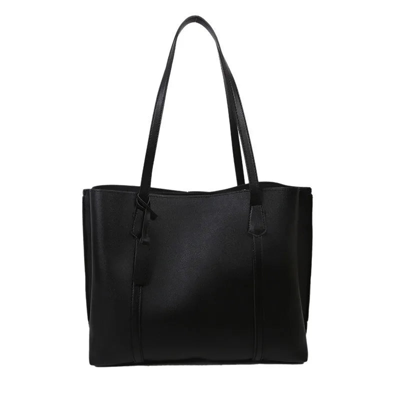 Large capacity soft leather tote bag in beige with synthetic leather lining and double shoulder straps.