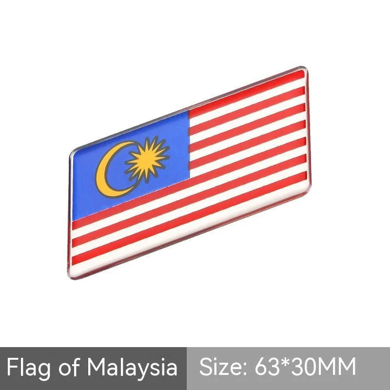 Aluminium national flag car sticker in a parallelogram shape measuring 6.3 by 3 centimetres.