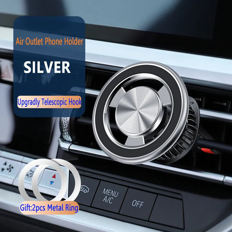 Silver air vent magnetic phone holder mounted on car dashboard with smartphone attached