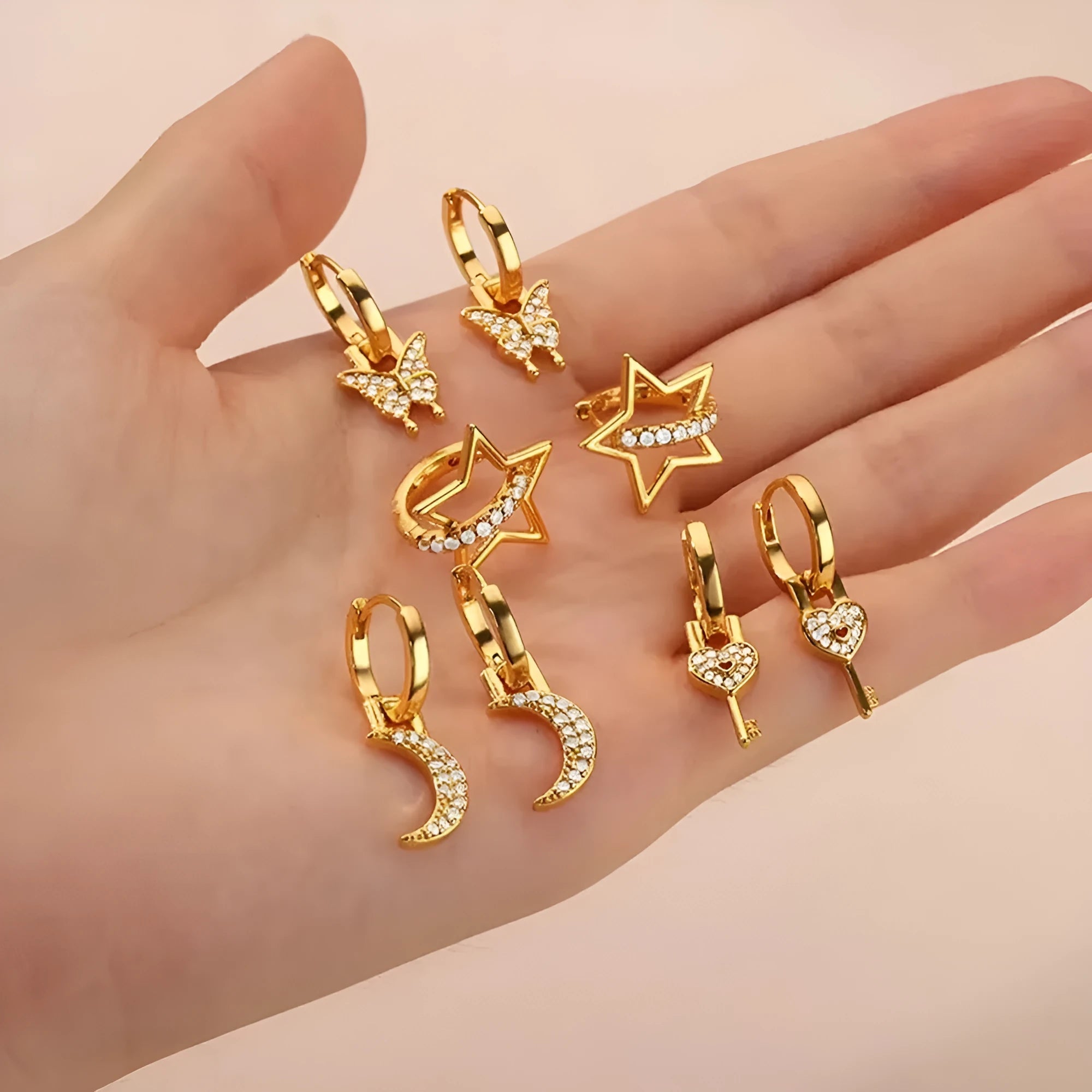 Women's copper butterfly earrings with geometric heart, star, and bow shapes in assorted colours.