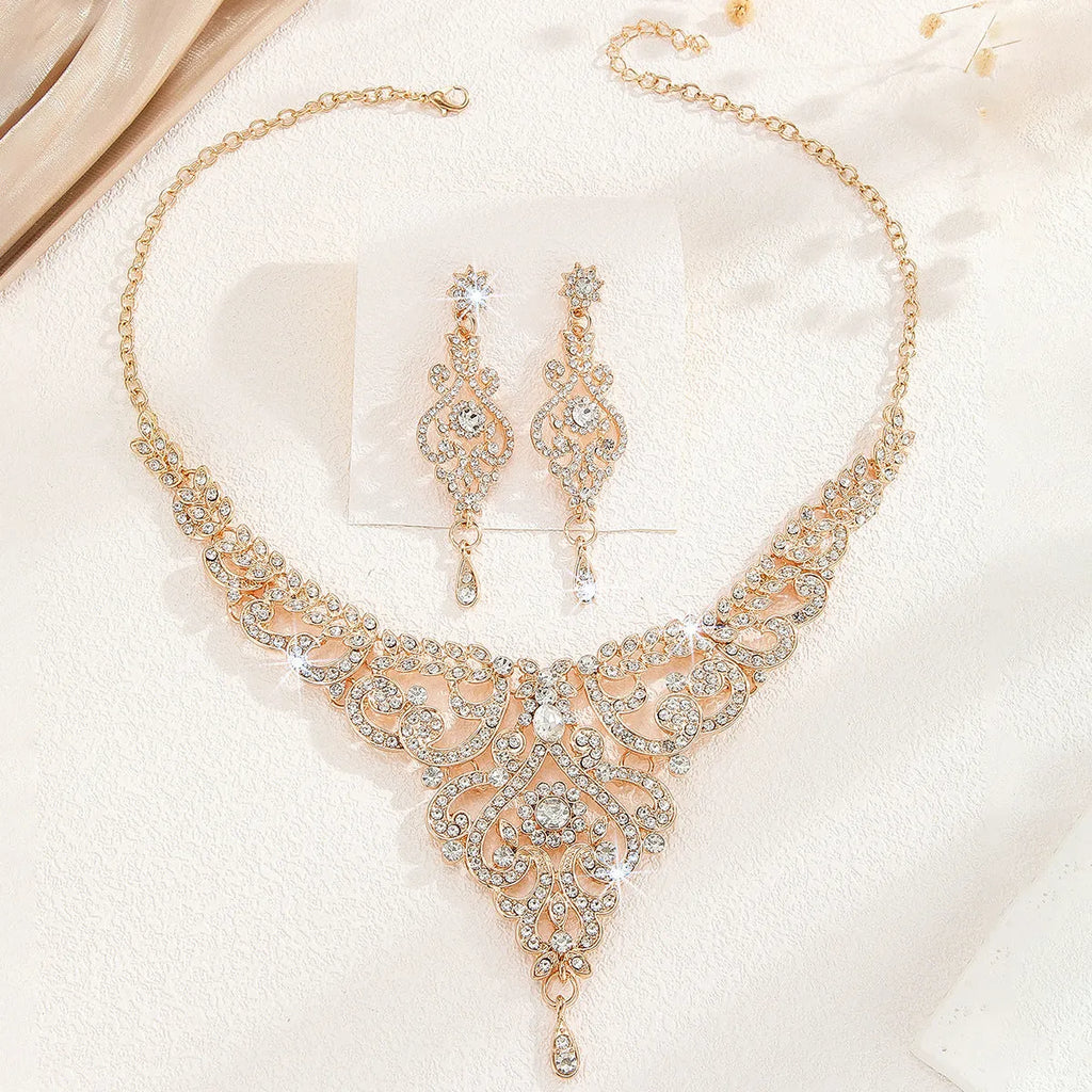 Hollow necklace and earrings set for women in gold or silver alloy with heart, water drop, or bell pattern