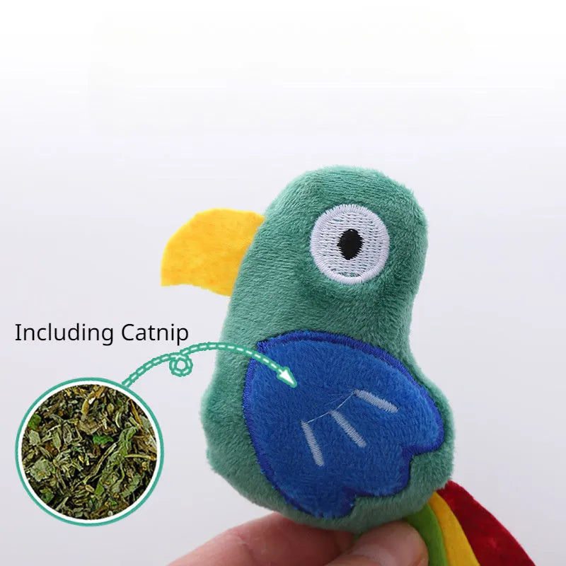 Plush cat toy shaped like a cow, crocodile, or parrot on a plain background.