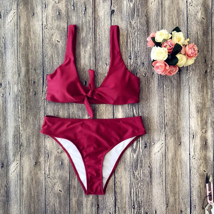 Women's solid colour bikini swimsuit set in polyester, showing sleeveless bra and matching briefs.