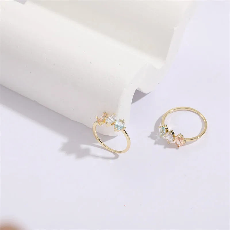 Geometric triangle birthstone ring with horse eye tricolour zircon in gold electroplated finish