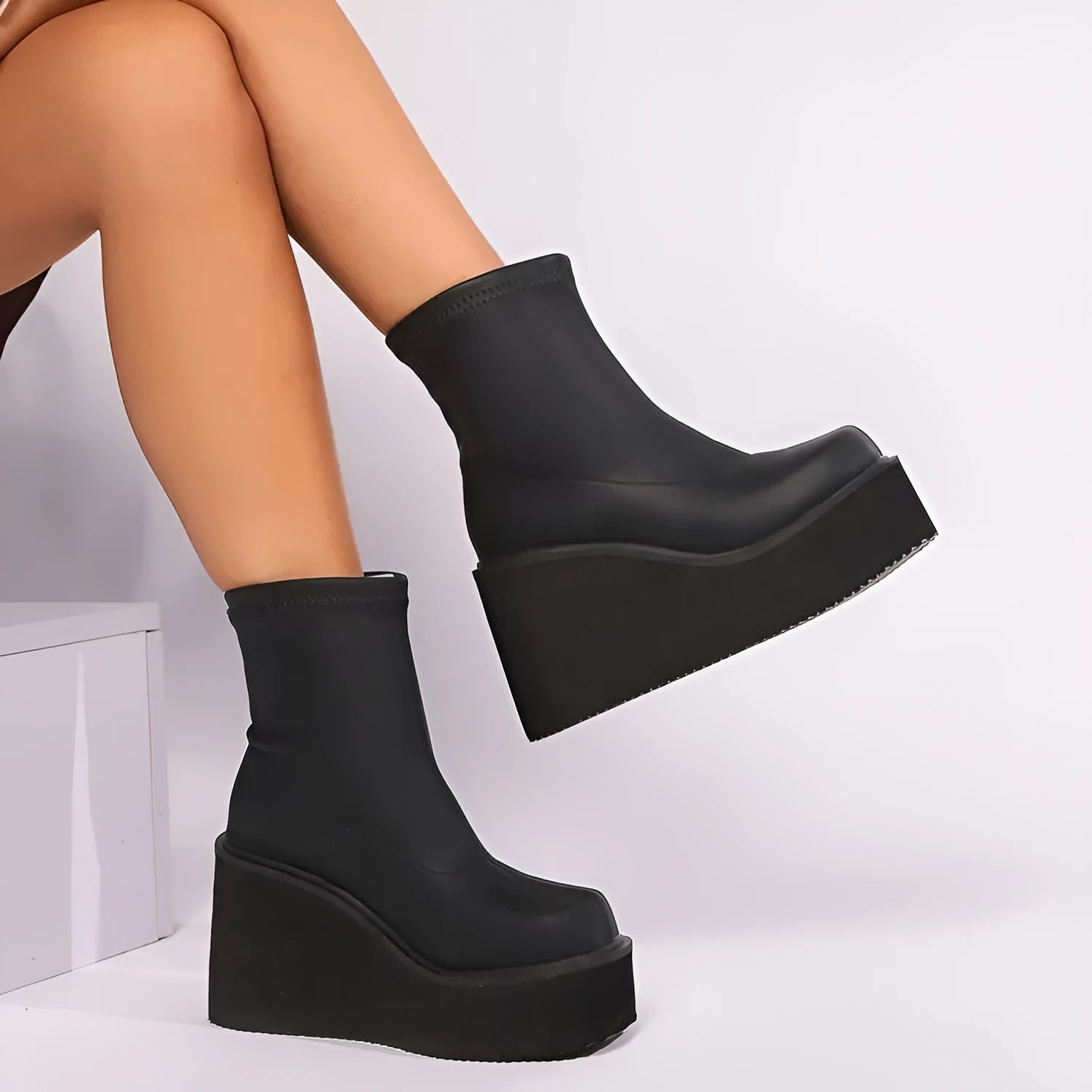Women's black waterproof platform boots with wedge heels and round toe