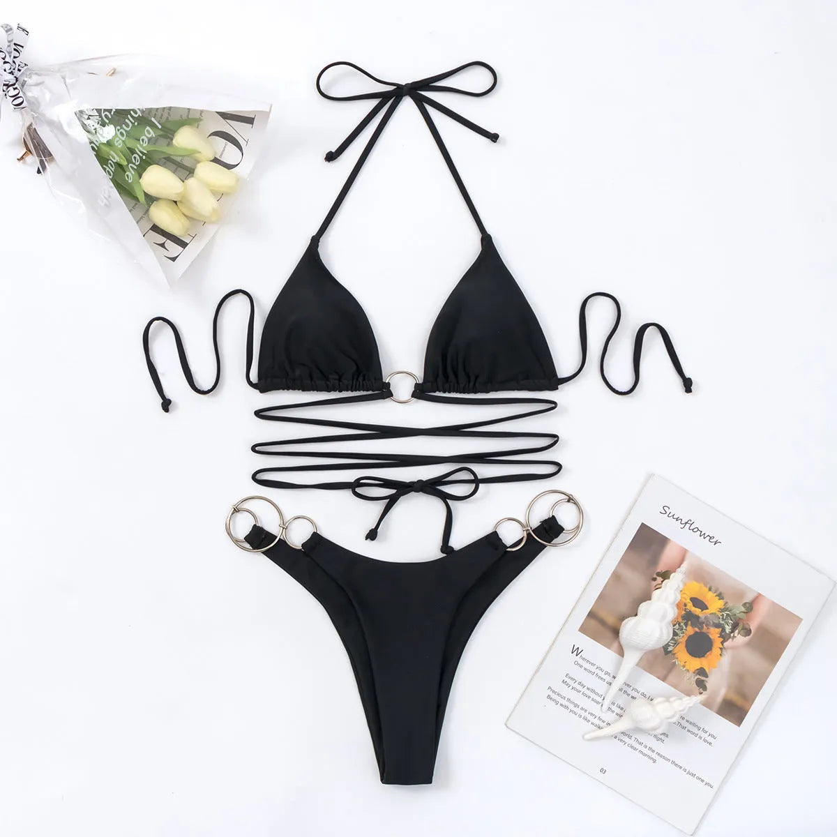 Black women's bikini swimsuit with metal ring straps and backless design for swimming and fitness