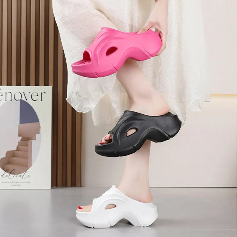 Women's white thick-soled EVA slippers with round toe on a beach background