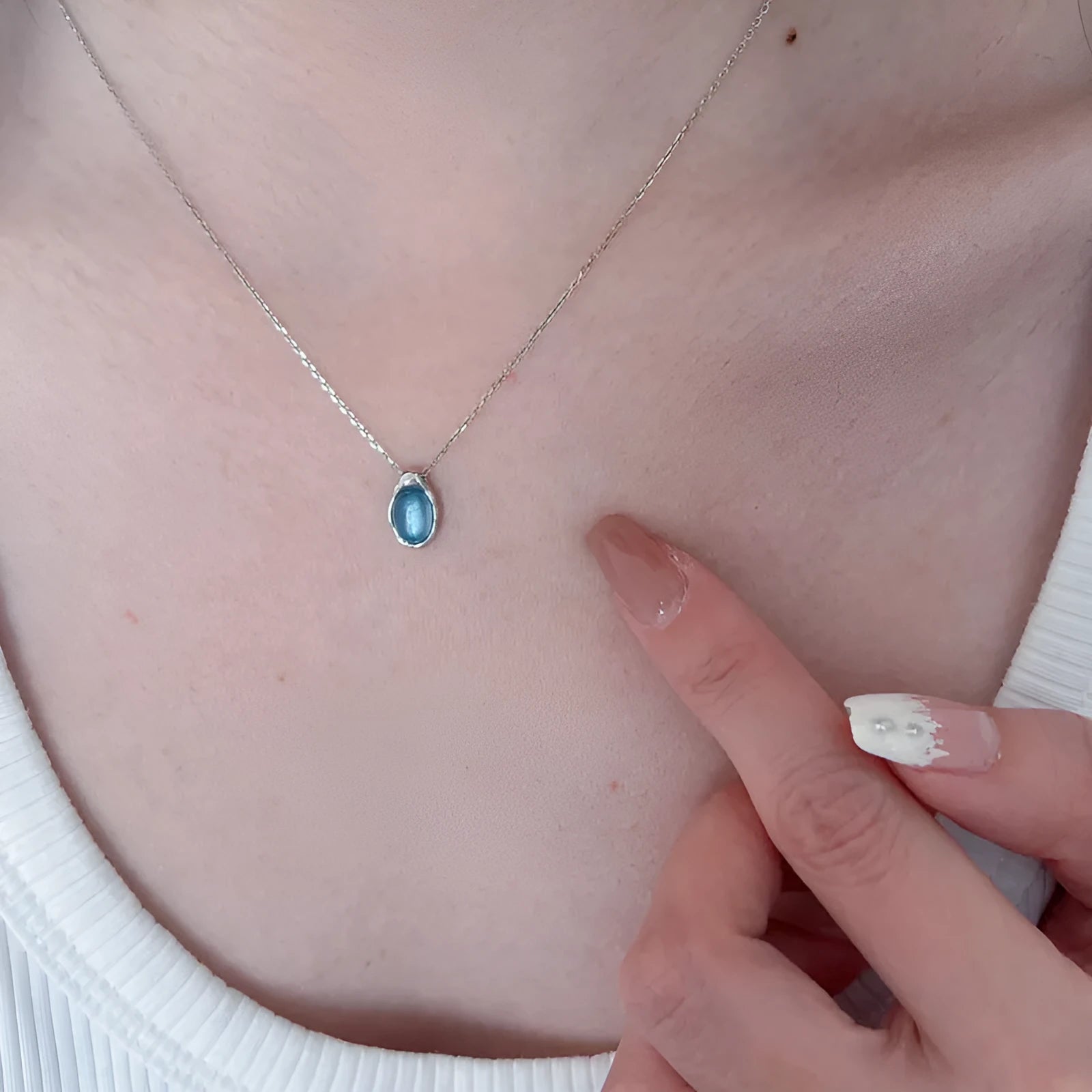 Navy blue water drop pendant necklace with cross chain in electroplated platinum colour finish