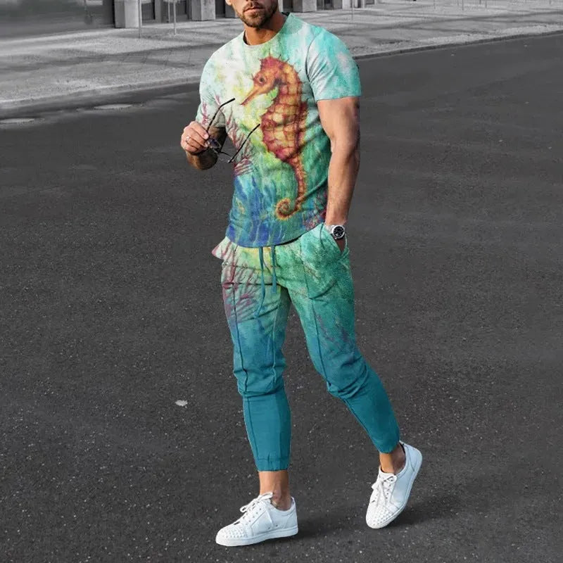 Man wearing a short sleeve printed pullover and matching trousers from a men's two-piece sports set.