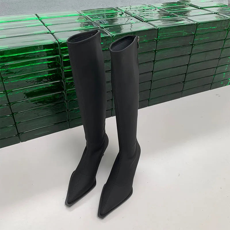 Black pointed toe women's below knee boots with stiletto heel and back zipper.