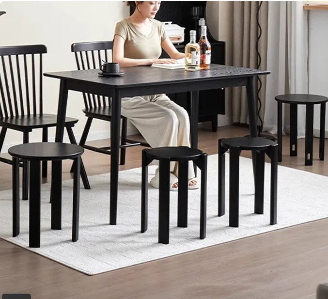 Stackable round metal dining stool in smoked black walnut finish with modern simple design