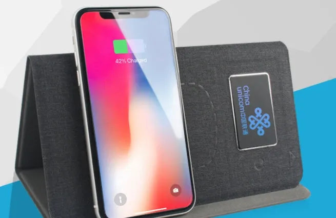 Folding wireless charging mouse pad set with luminous features and wireless mouse on desk