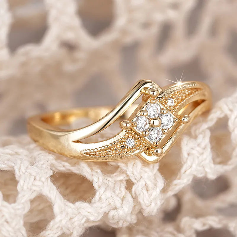 Yellow gold copper diamond ring with geometric design and inlaid zircon detailing