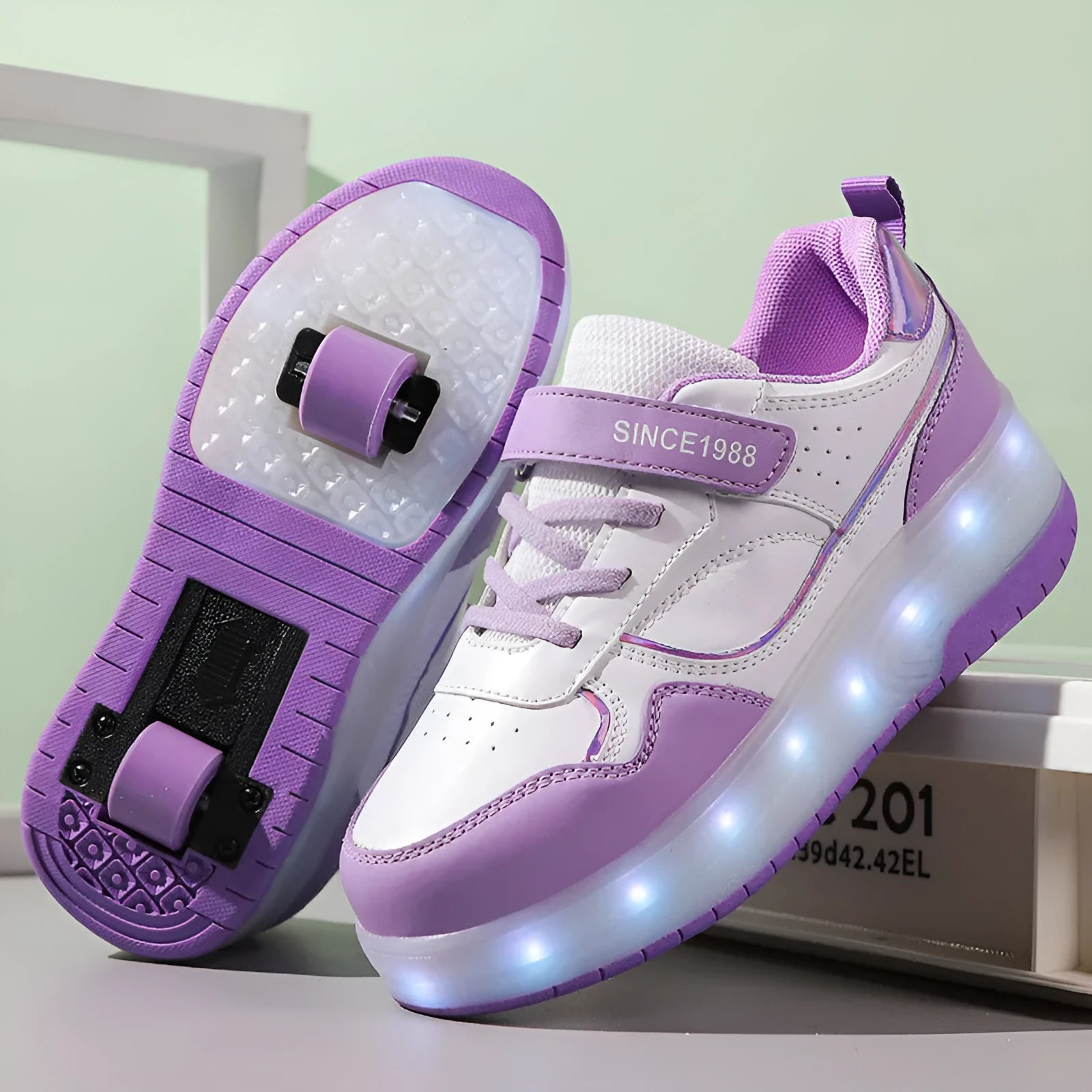 Child wearing charging flash rollerskates with illuminated LED wheels, showing pink and black colour options.