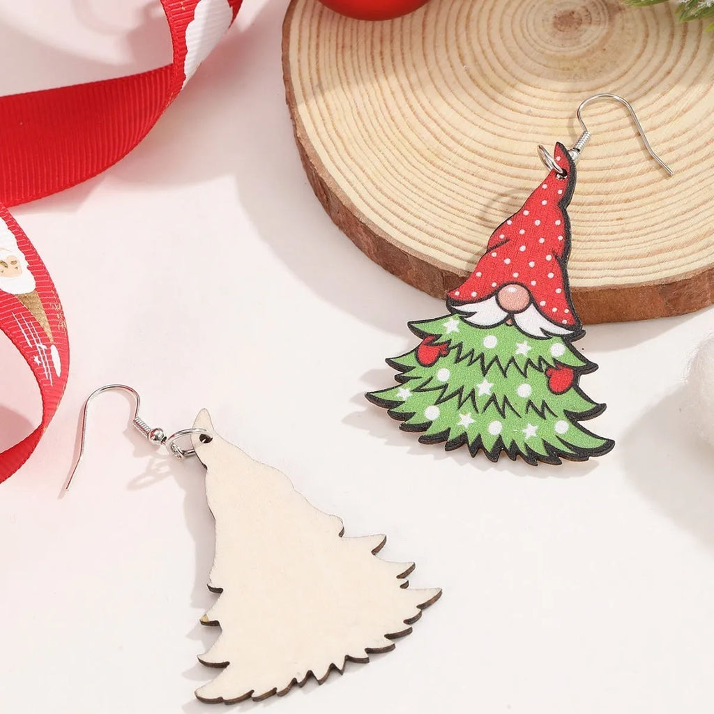 Wooden geometric earrings with printed Christmas tree and snowman Santa Claus designs.