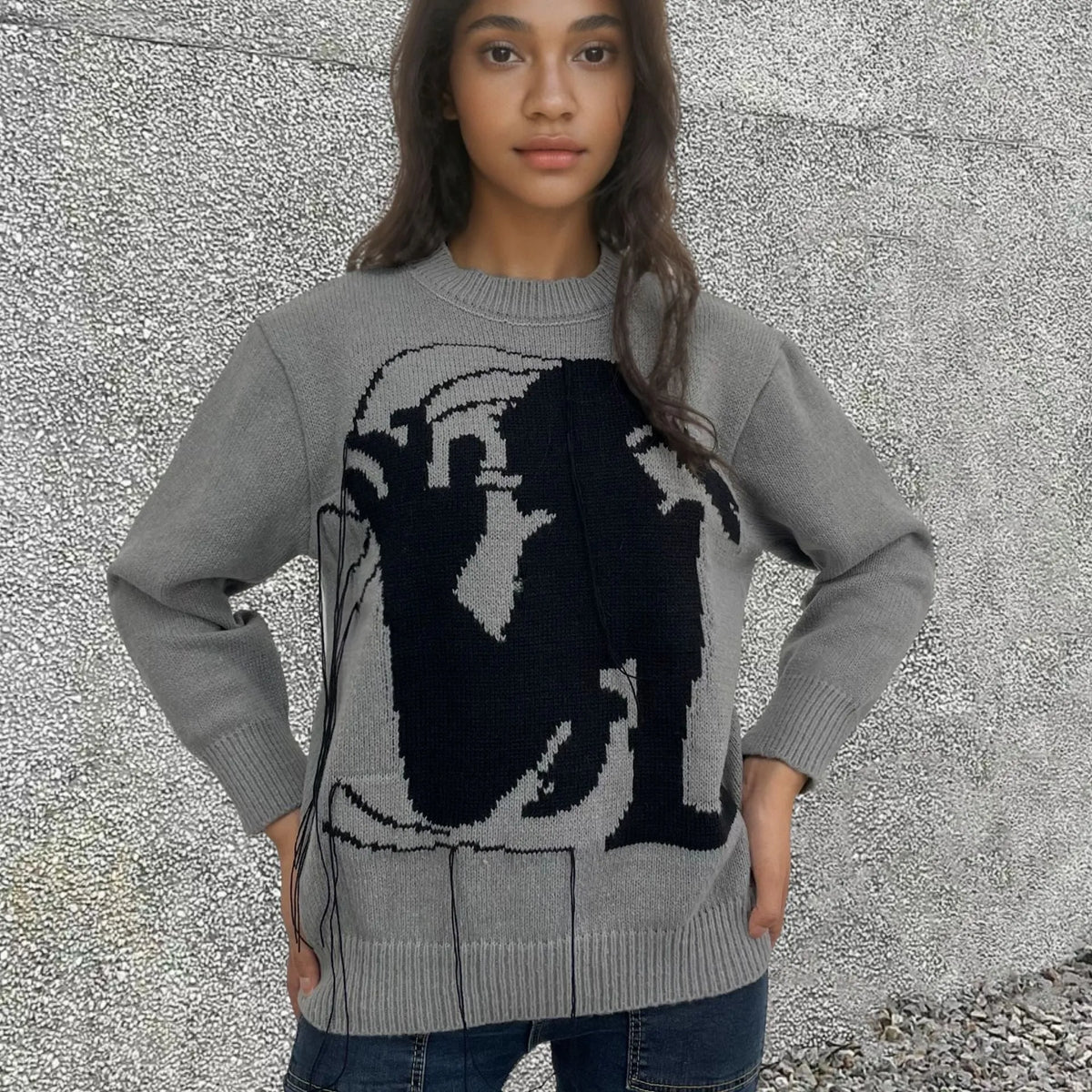 Women's loose fit alpaca wool sweater with tassel details and abstract pattern in street fashion style