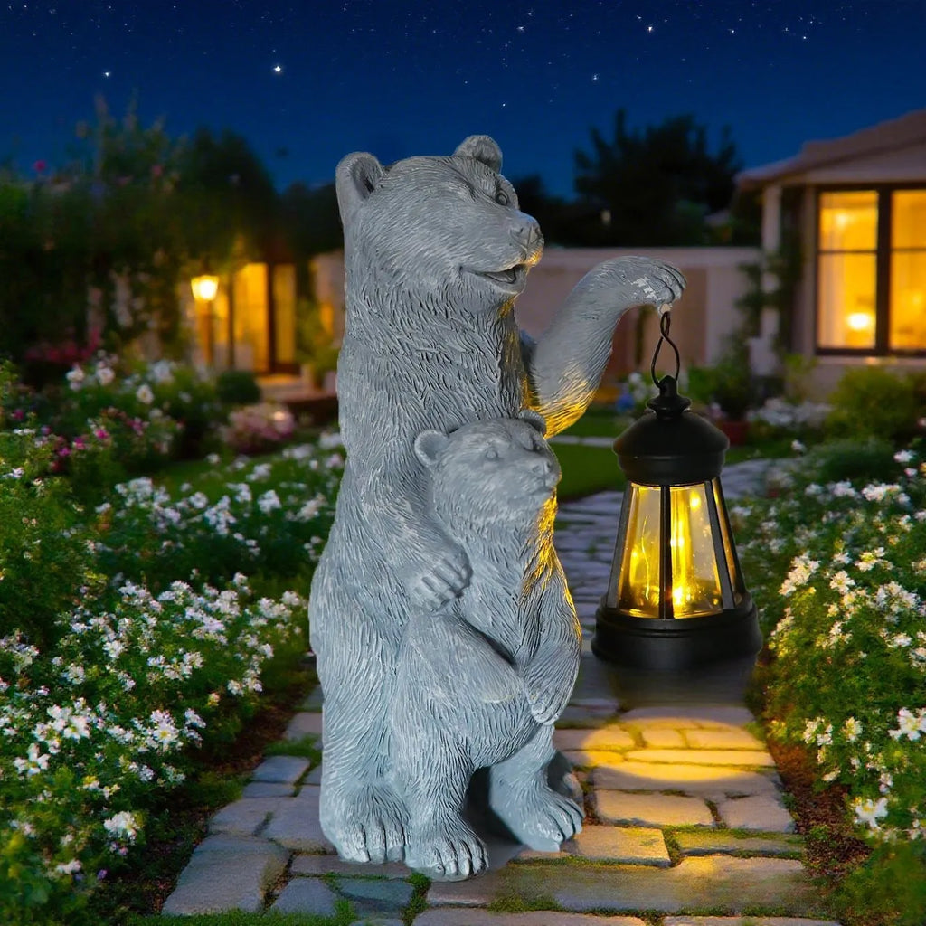 Resin black bear mother and child lantern ornament on a wooden shelf with soft glow