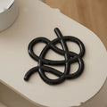 Ceramic heat proof mat with irregular shape on dining table