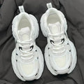 Beige mesh sports shoes with wedge heel and lace-up front on rubber sole