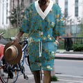 Men's peacock blue knitted shorts and matching T-shirt set laid flat showing complete leisure outfit