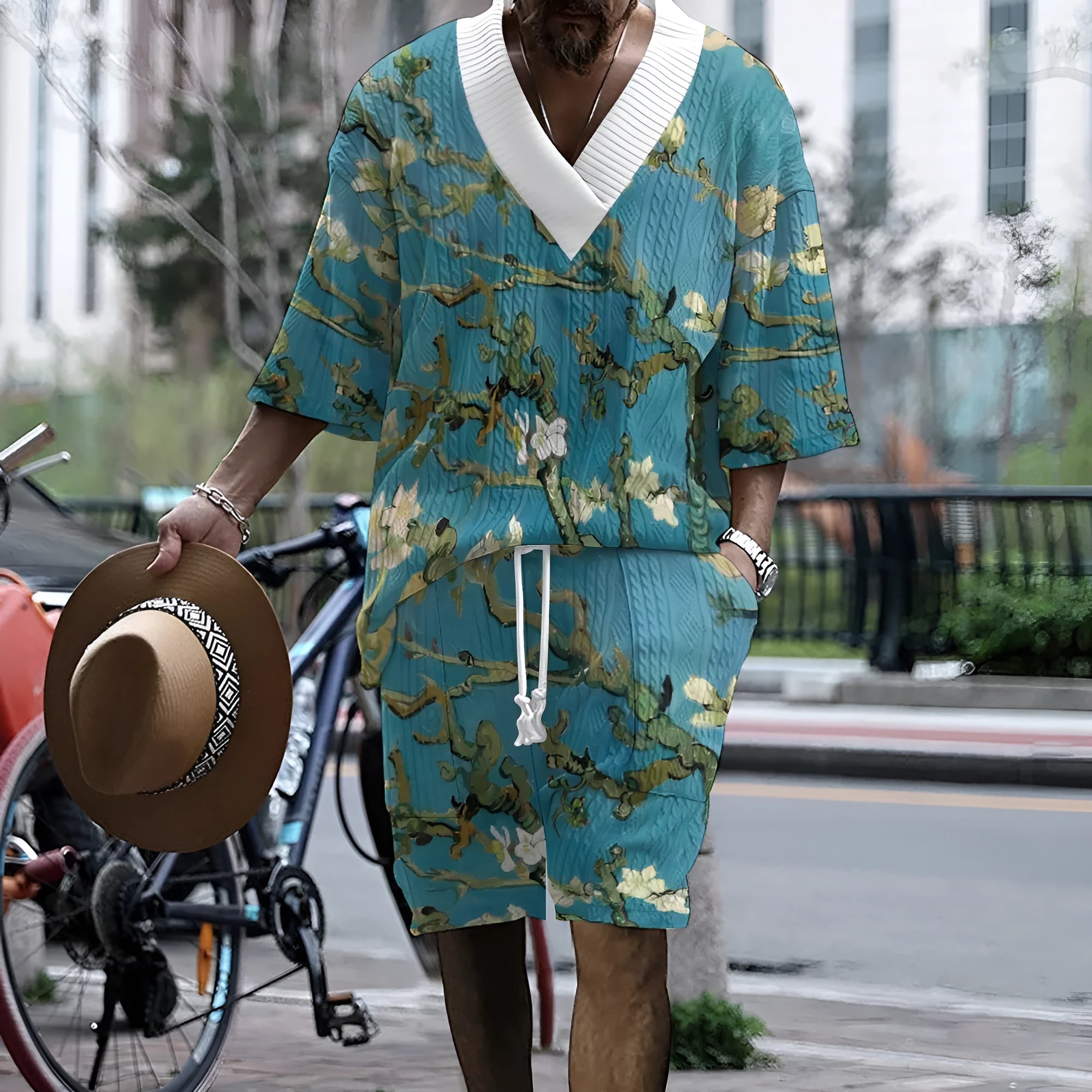Men's peacock blue knitted shorts and matching T-shirt set laid flat showing complete leisure outfit