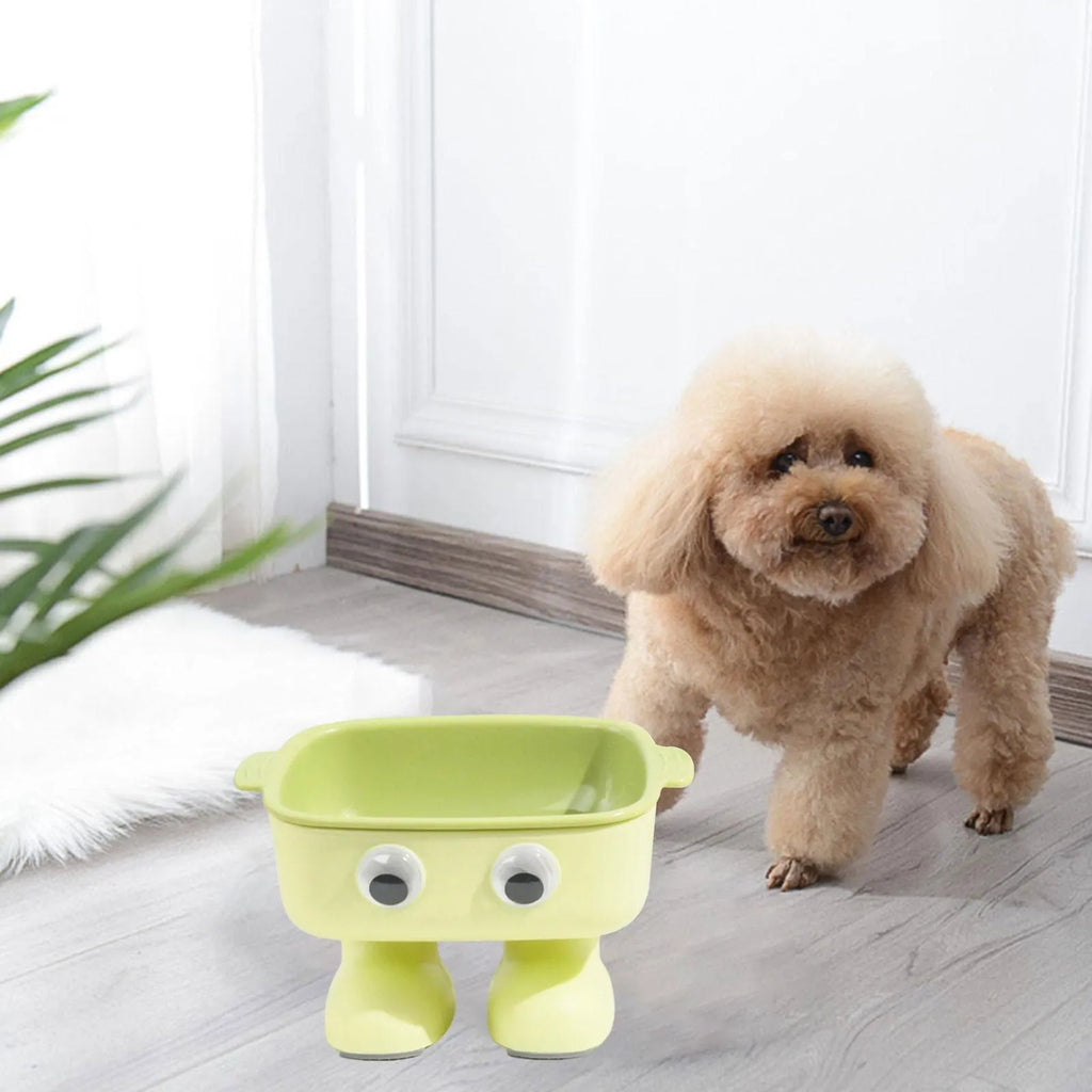 Green cartoon robot shaped elevated cat bowl with a tilted, detachable inner food dish.
