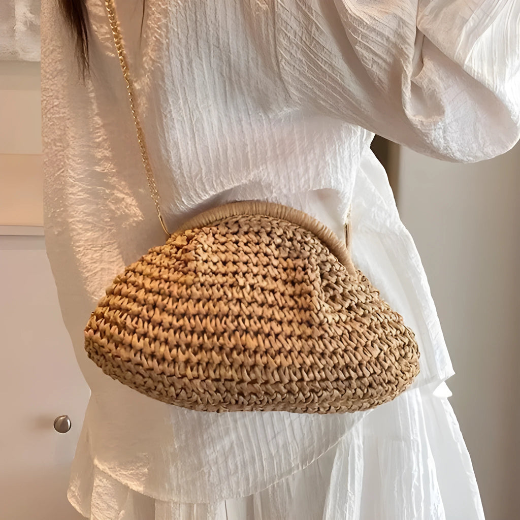 Women's straw handbag with shell shape, chain detail, and khaki colour option