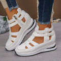 Women's black hollow-out platform sandals with a Velcro strap and round toe.