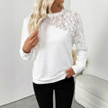 White long sleeve pullover top with floral pattern, loose fit design
