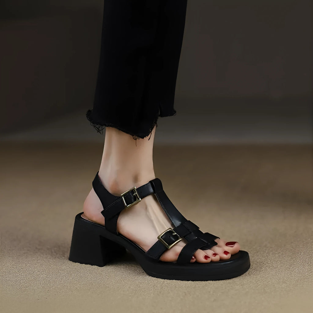 Black women's retro sandals with T-shaped buckle, open toe, chunky platform heel, and square toe shape.