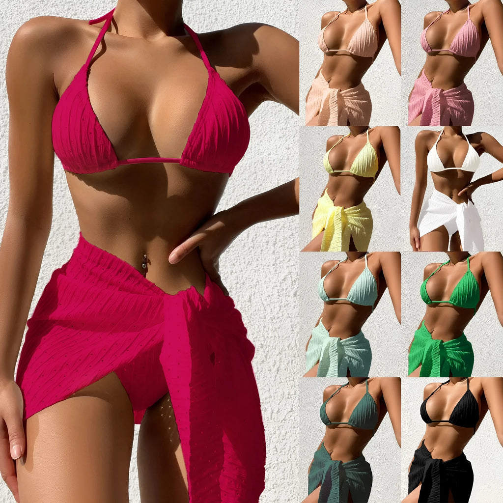 Women's halterneck backless bikini top and mesh skirt swimsuit set in a solid colour.