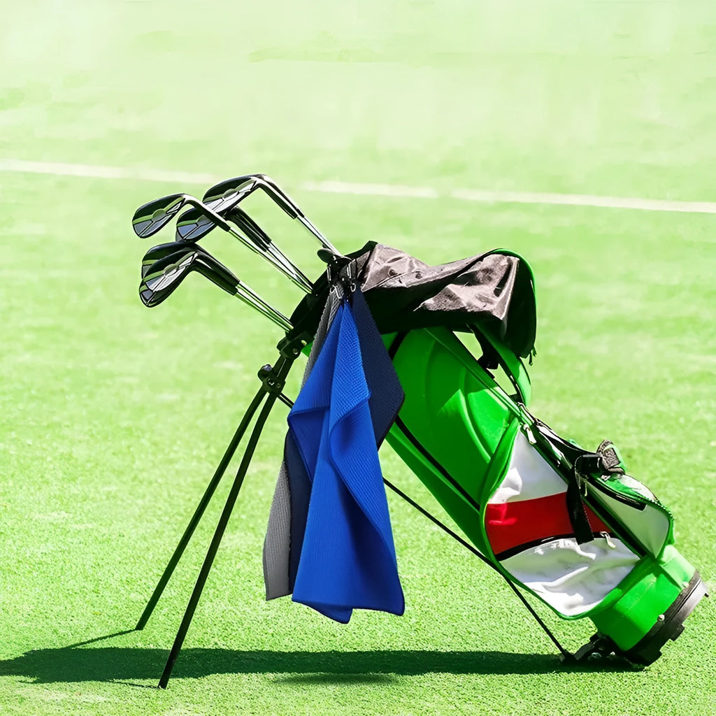 Waffle weave golf ball cleaning cloth in blue, showing textured surface and rectangular shape.