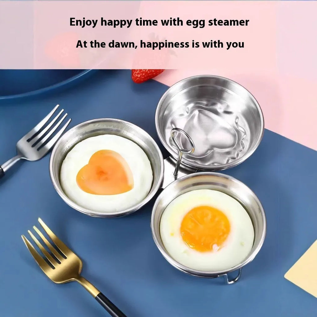 Stainless steel heart-shaped egg steamer next to a round model on a kitchen counter.