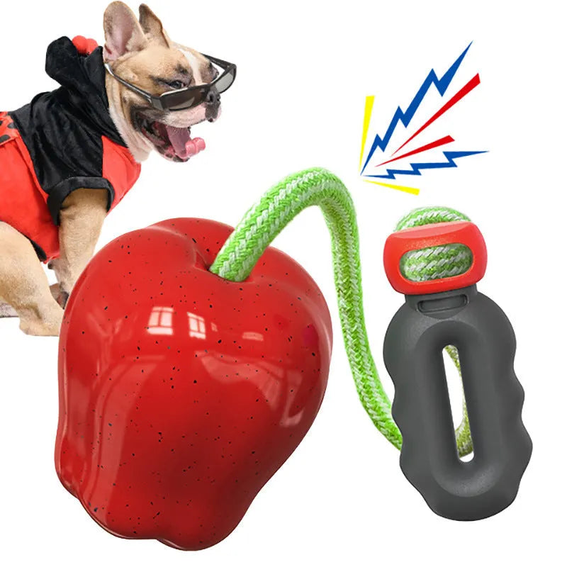 Green plastic dog toy shaped like apple with food dropping hole and molar chewing texture