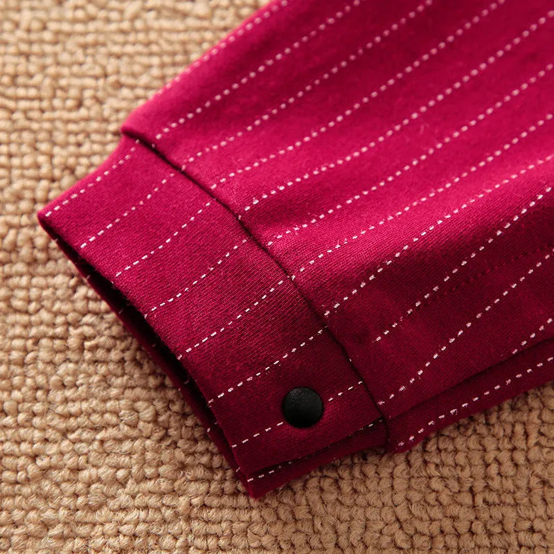 Wine red cotton baby boy romper with long sleeves and single-breasted buttons.