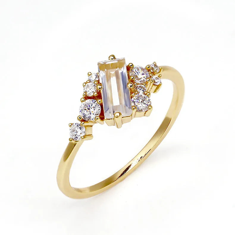 White crystal shiny electroplated silver women's ring on a white background