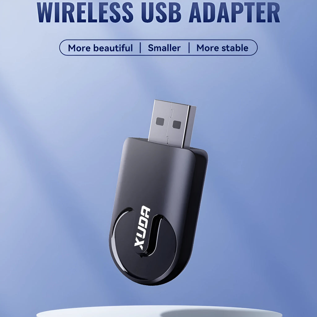 Small black 2-in-1 USB car adapter for wireless CarPlay and data transfer on a dark surface.